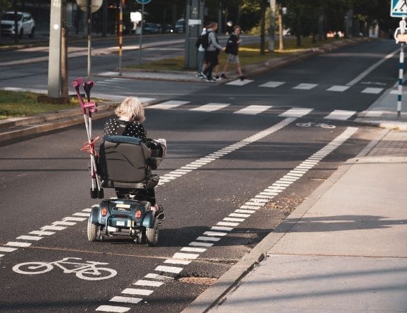Disabilities in Israel - woman in wheelchair on bike path